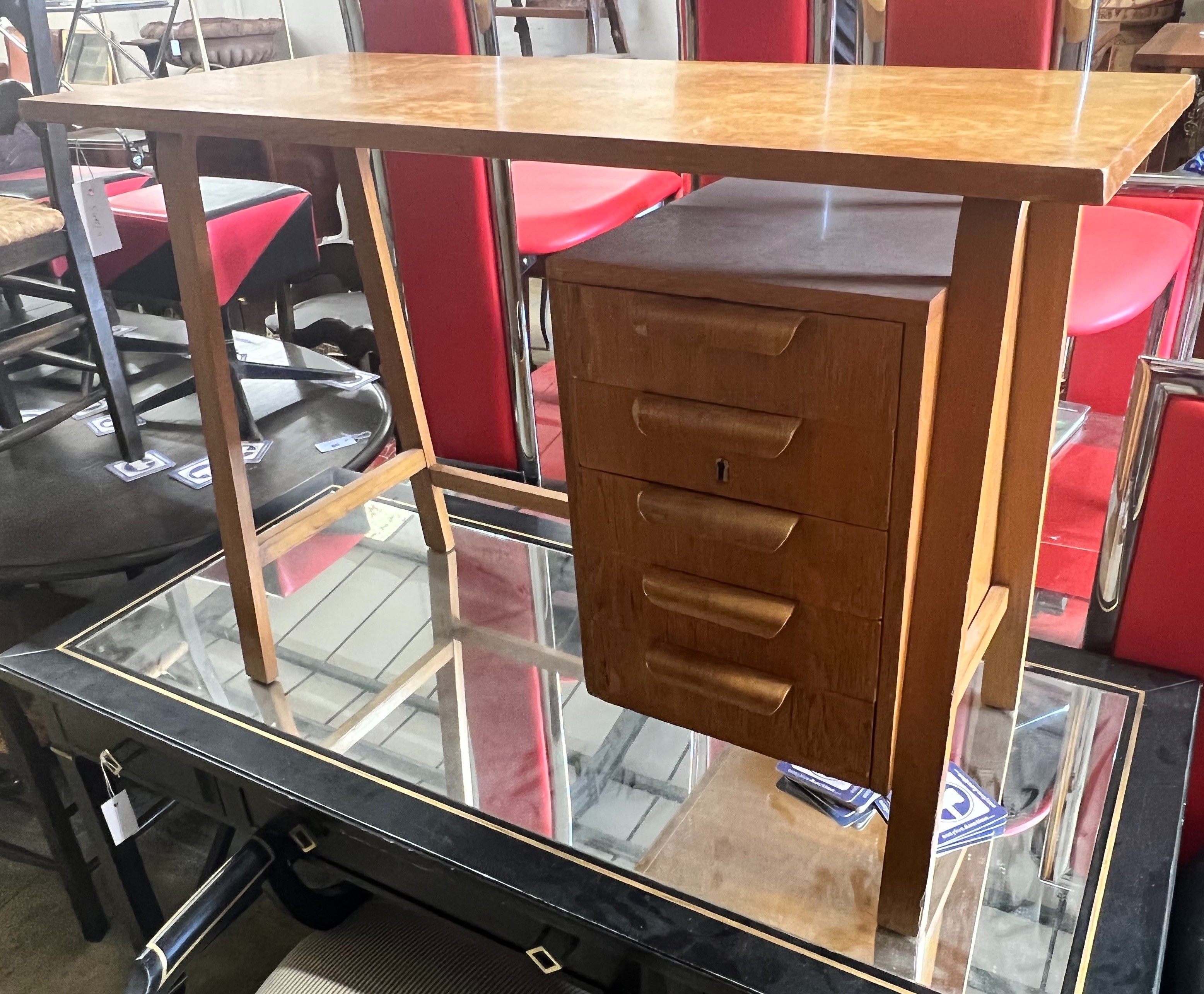 A Gordon Russell teak desk, width 99cm, depth 44cm height 69cm